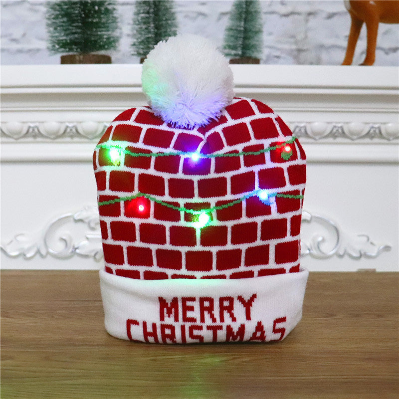 Gluschwein - Bunte leuchtende gestrickte Weihnachtsmütze WAND